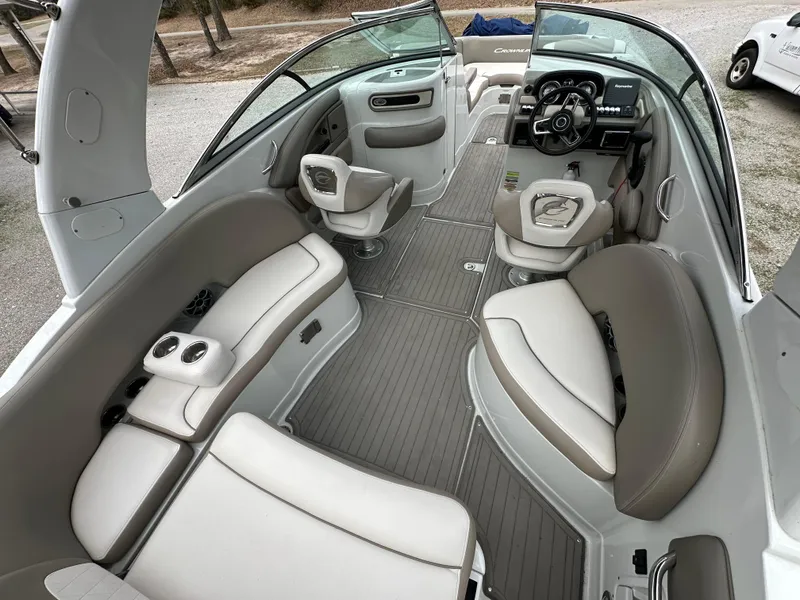 Slide: The Image of 2018 Crownline Eclipse E25 boat interior with spacious seating and modern dashboard. - 5