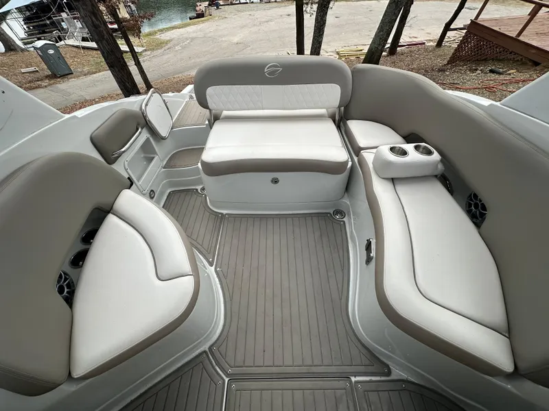 Slide: The Image of 2018 Crownline Eclipse E25 boat interior with spacious seating and cup holders. - 9