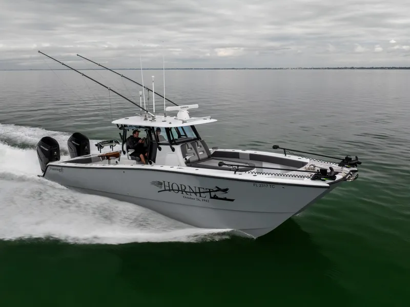 Slide: The Image of 2022 Freeman 37 VH boat cruising on calm water under cloudy skies. - 0