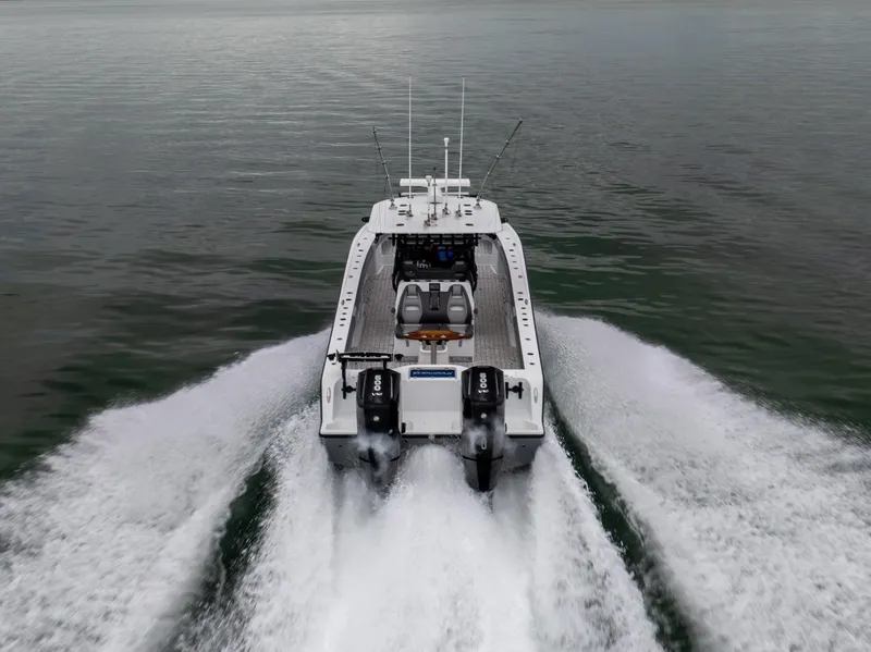 Slide: The Image of Freeman 37 VH 2022 boat cruising on open water, rear view. - 1