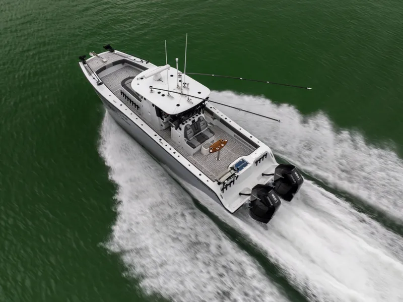 Slide: The Image of Freeman 37 VH 2022 boat cruising on green water, aerial view. - 10