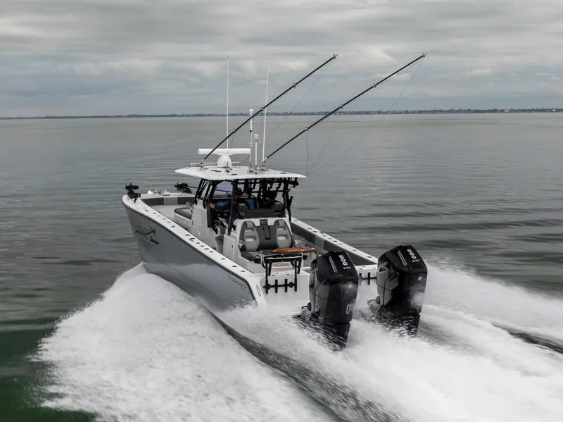 Slide: The Image of 2022 Freeman 37 VH boat cruising on open water with dual engines. - 2