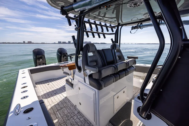 Slide: The Image of 2022 Freeman 37 VH boat interior with seating and dual engines on open water. - 30