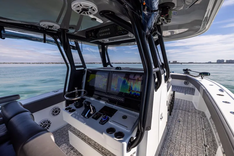 Slide: The Image of 2022 Freeman 37 VH boat interior with advanced navigation system on calm waters. - 32