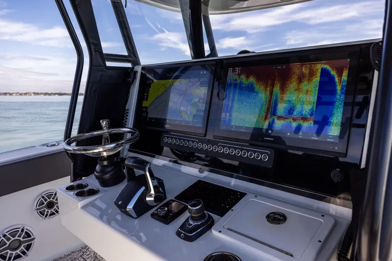 Slide: The Image of Freeman 37 VH 2022 boat dashboard with advanced navigation and control systems. - 33