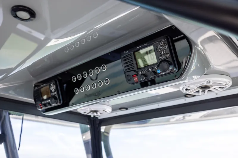 Slide: The Image of Control panel of a 2022 Freeman 37 VH boat, featuring modern navigation equipment. - 37