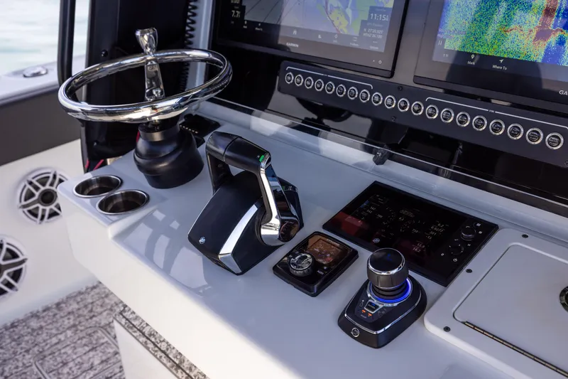 Slide: The Image of 2022 Freeman 37 VH boat dashboard with steering wheel and control panel. - 38
