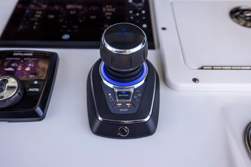 Slide: The Image of Boat control panel with joystick, Freeman 37 VH, 2022 model, featuring advanced navigation technology. - 39