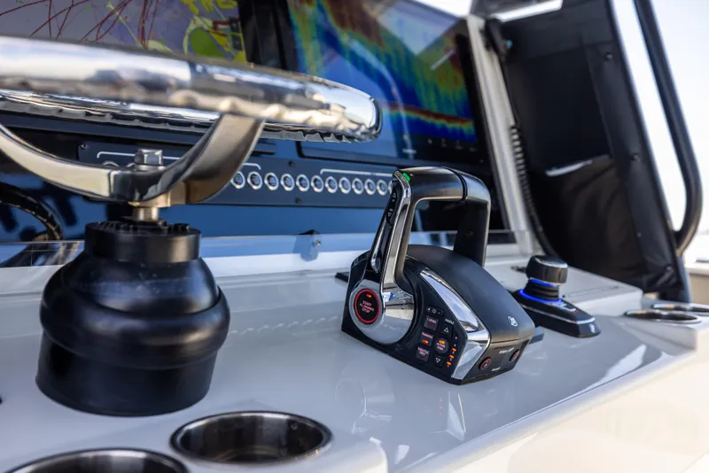 Slide: The Image of 2022 Freeman 37 VH boat dashboard with steering wheel and control panel. - 41