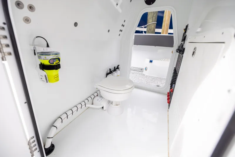 Slide: The Image of Interior of a 2022 Freeman 37 VH boat featuring a compact marine toilet. - 45
