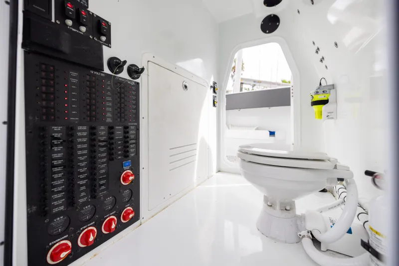 Slide: The Image of Interior of 2022 Freeman 37 VH boat with control panel and marine toilet. - 46