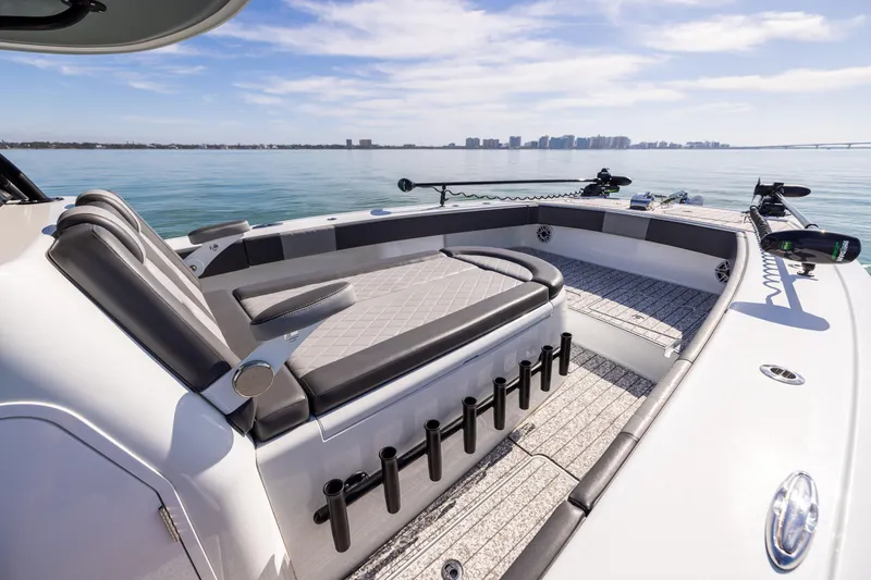 Slide: The Image of 2022 Freeman 37 VH boat interior with seating, rod holders, and ocean view. - 48