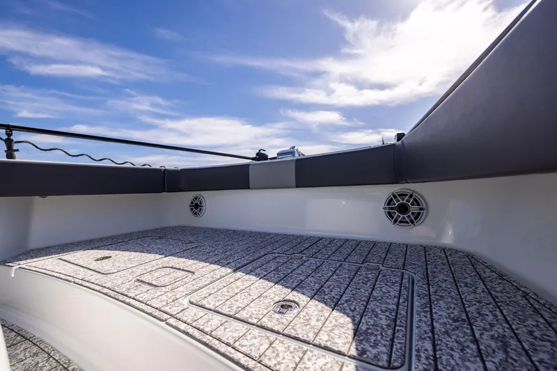 Slide: The Image of Freeman 37 VH 2022 boat deck with speakers under a clear blue sky. - 49