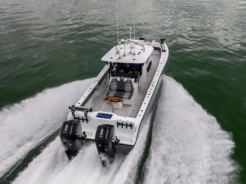 Slide: The Image of 2022 Freeman 37 VH boat cruising on water with dual engines. - 6