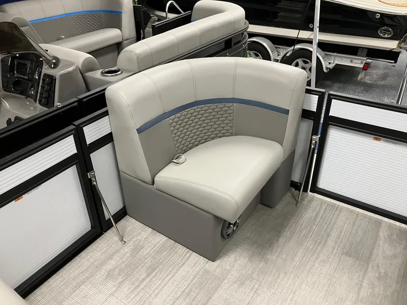 Slide: The Image of 2024 Qwest 816 XRE Cruise boat interior with gray seating and modern design. - 10