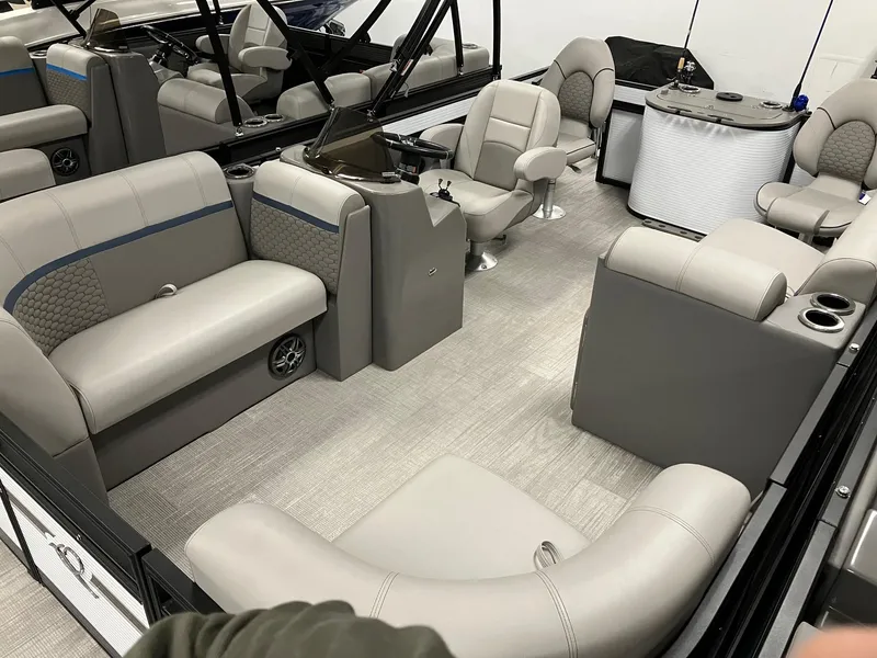 Slide: The Image of 2024 Qwest 816 XRE Cruise boat interior with gray seating and modern design. - 2
