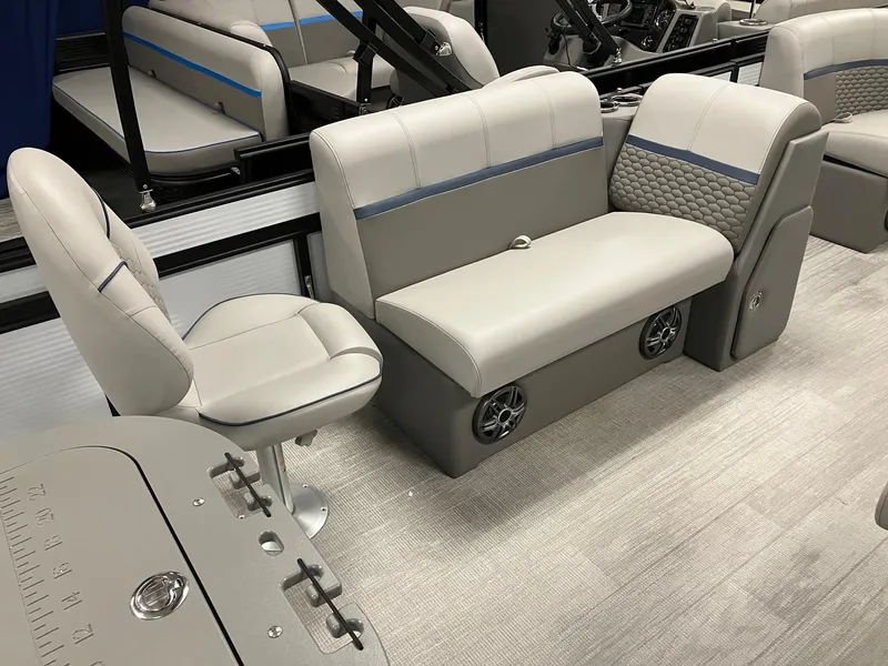 Slide: The Image of 2024 Qwest 816 XRE Cruise boat interior with gray seating and modern design. - 5