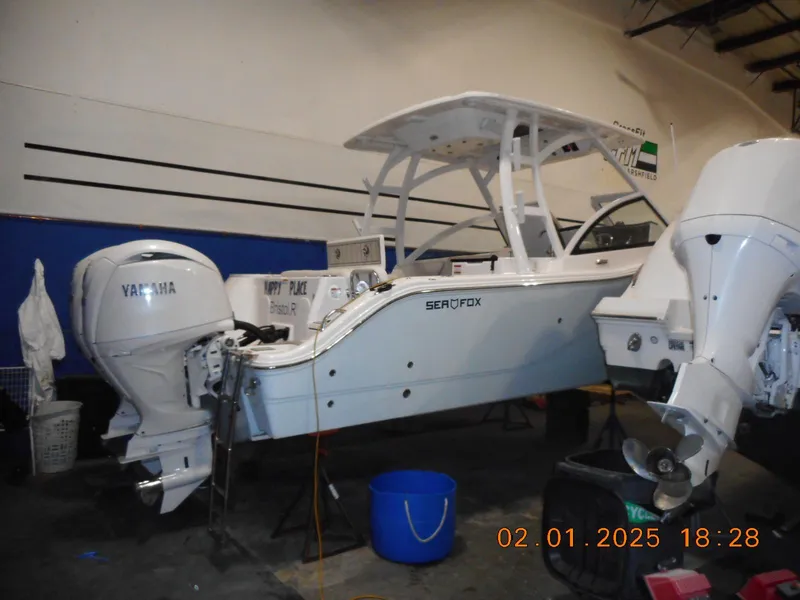 Slide: The Image of 2024 Sea Fox 268 Traveler boat in a workshop with Yamaha engines. - 6