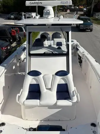 Slide: The Image of 2012 Everglades 325 Center Console boat with Garmin equipment, featuring spacious seating and sleek design. - 10