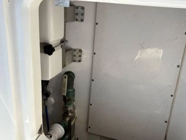 Slide: The Image of Interior compartment of 2012 Everglades 325 Center Console boat, showing mechanical components. - 15