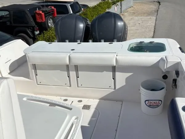 Slide: The Image of 2012 Everglades 325 Center Console boat with dual engines and fishing equipment. - 7