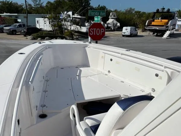 Slide: The Image of 2012 Everglades 325 Center Console boat at dock near Florida Avenue stop sign. - 9