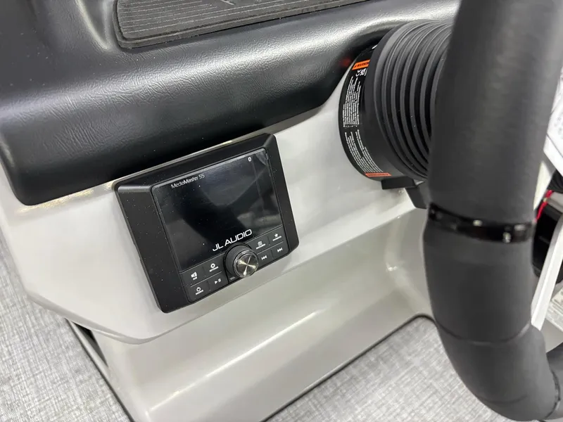 Slide: The Image of 2025 Harris CRUISER 230 SLDH dashboard featuring JL Audio system. - 15