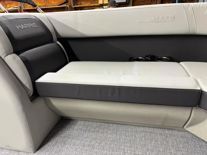 Slide: The Image of 2025 Harris CRUISER 230 SLDH boat interior seating with cup holders. - 17