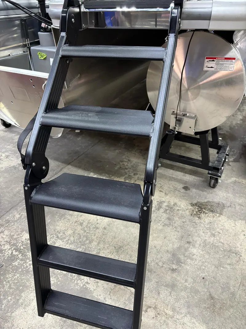 Slide: The Image of Sturdy black steps on a 2025 Harris CRUISER 230 SLDH boat. - 19