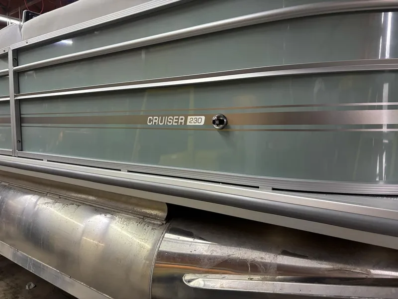 Slide: The Image of 2025 Harris CRUISER 230 SLDH pontoon boat side view with sleek design. - 3