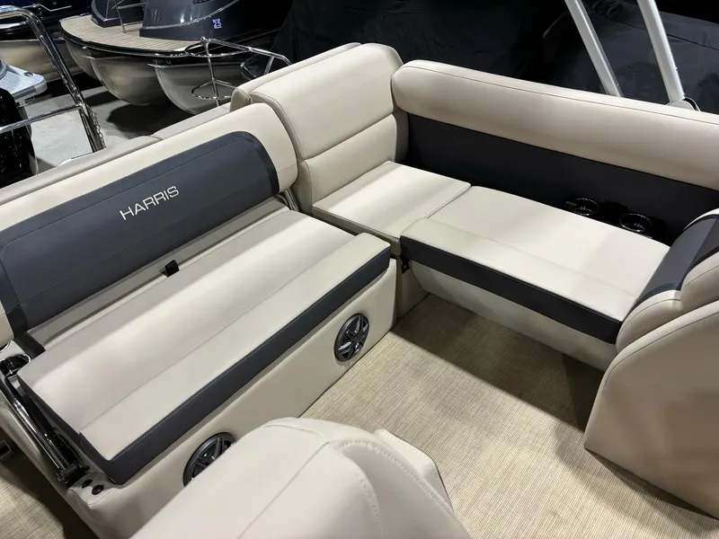 Slide: The Image of 2025 Harris CRUISER 230 SLDH boat interior with beige and gray seating. - 5