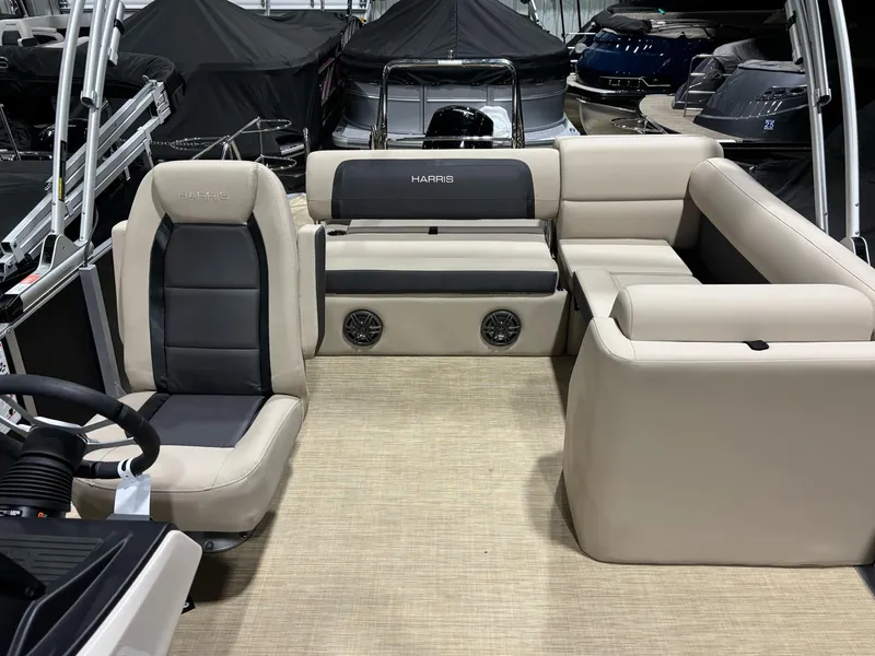 Slide: The Image of 2025 Harris CRUISER 230 SLDH interior with beige and black seating, spacious layout. - 9