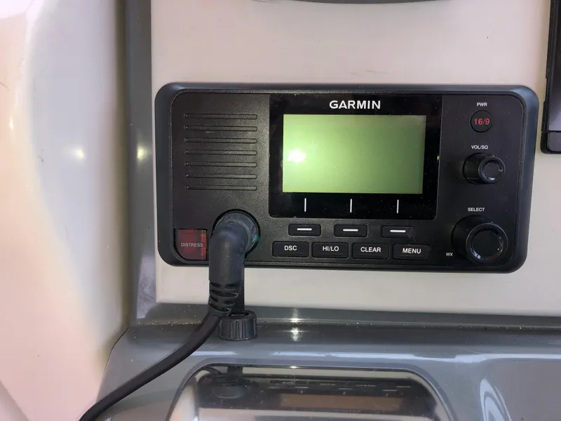 Slide: The Image of Garmin marine radio on 2000 Tiara Yachts 3100 Open dashboard. - 11