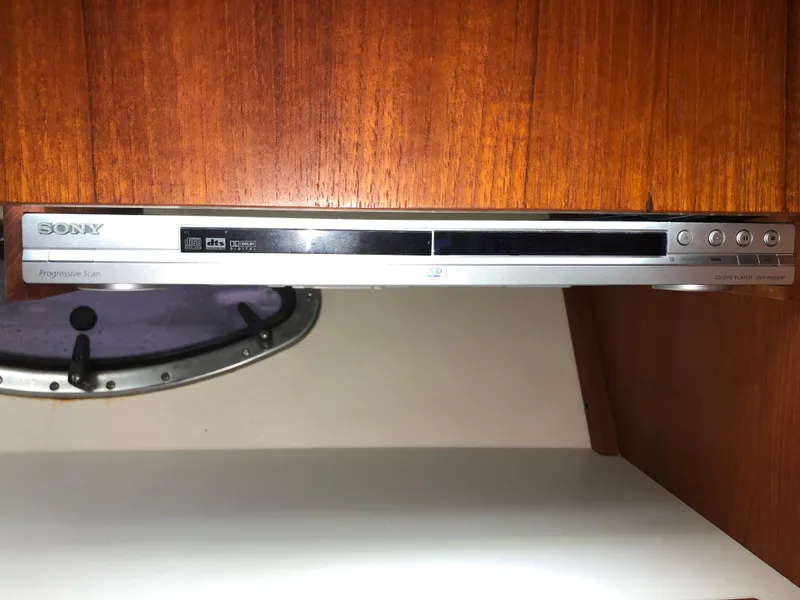 Slide: The Image of Sony DVD player installed in a 2000 Tiara Yachts 3100 Open, wooden interior background. - 27