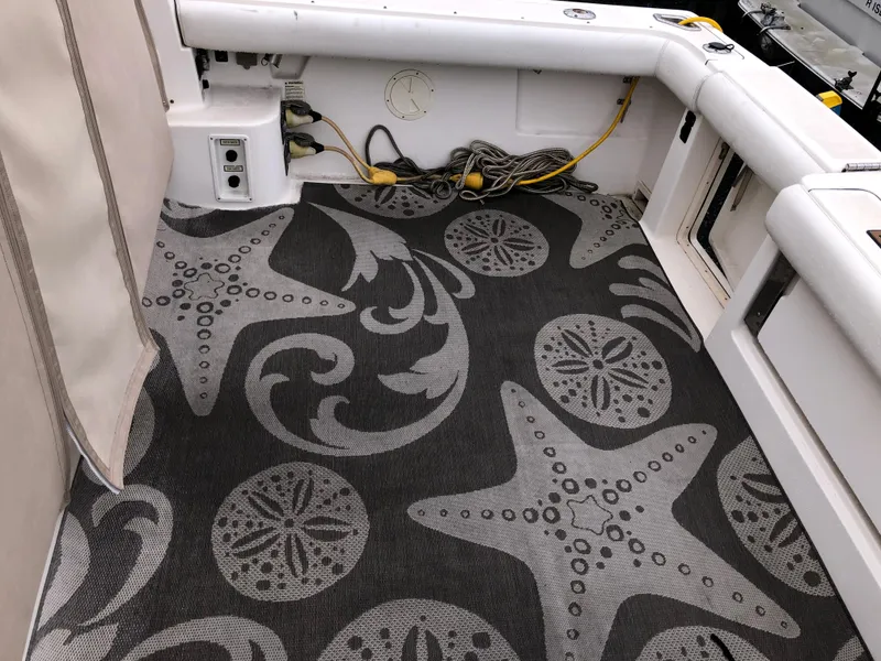 Slide: The Image of 2000 Tiara Yachts 3100 Open boat deck with starfish-patterned carpet. - 9