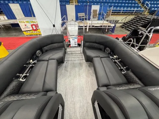 Slide: The Image of Luxurious seating on 2025 Harris Grand Mariner 250 pontoon boat, showcased indoors. - 19