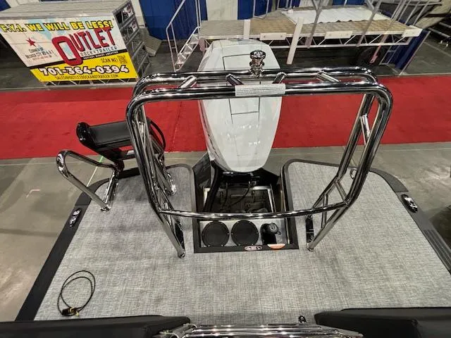 Slide: The Image of 2025 Harris Grand Mariner 250 boat interior with engine and seating, showcased at an event. - 20