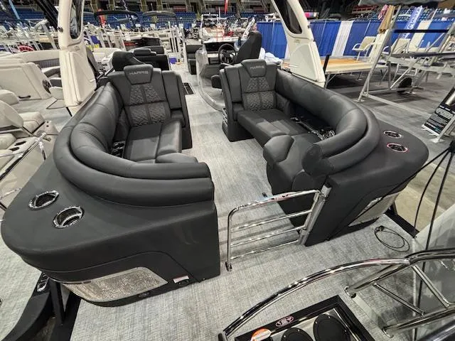 Slide: The Image of 2025 Harris Grand Mariner 250 interior with luxurious black seating and modern design. - 21