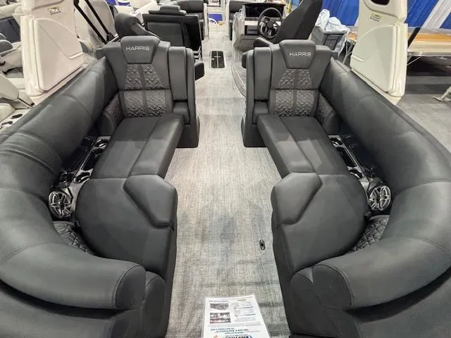 Slide: The Image of 2025 Harris Grand Mariner 250 interior with luxurious black seating and modern design. - 22
