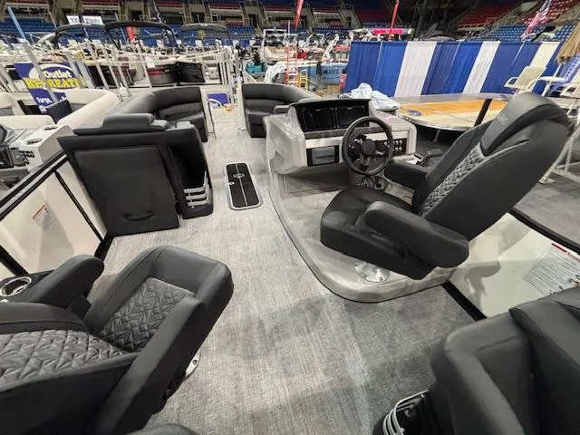 Slide: The Image of 2025 Harris Grand Mariner 250 boat interior with modern seating and steering console. - 24