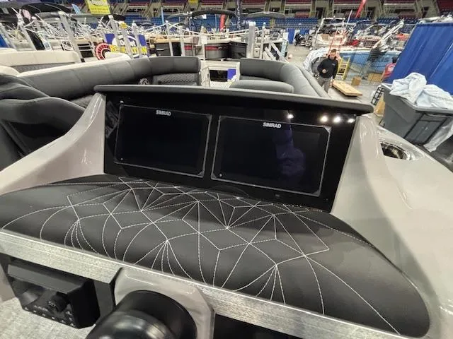 Slide: The Image of 2025 Harris Grand Mariner 250 dashboard with dual Simrad displays and stylish seating. - 29