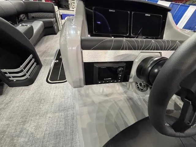 Slide: The Image of 2025 Harris Grand Mariner 250 dashboard with modern controls and dual screens. - 30