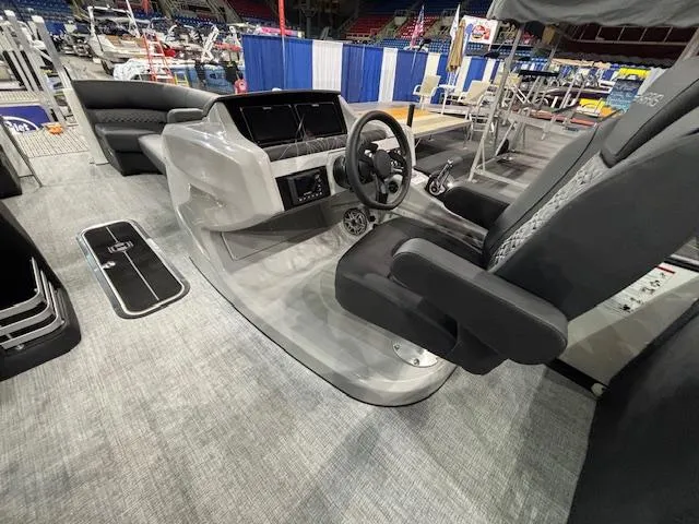 Slide: The Image of 2025 Harris Grand Mariner 250 boat interior with modern helm and seating. - 31