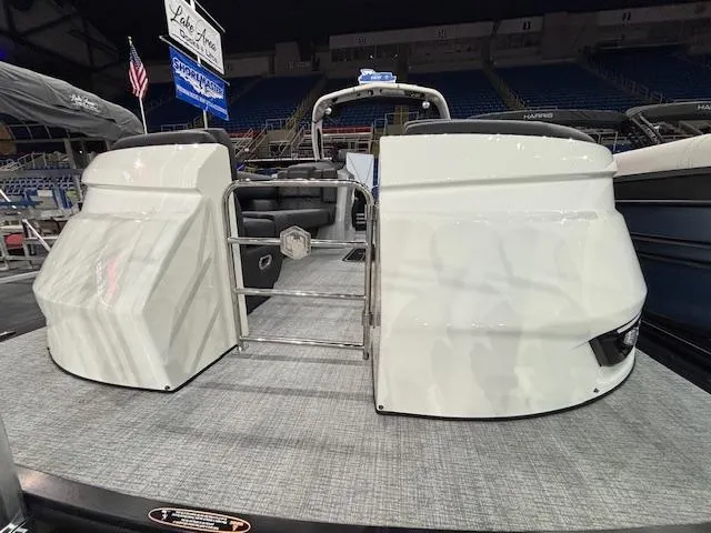 Slide: The Image of 2025 Harris Grand Mariner 250 pontoon boat displayed indoors, showcasing rear entry and seating. - 4