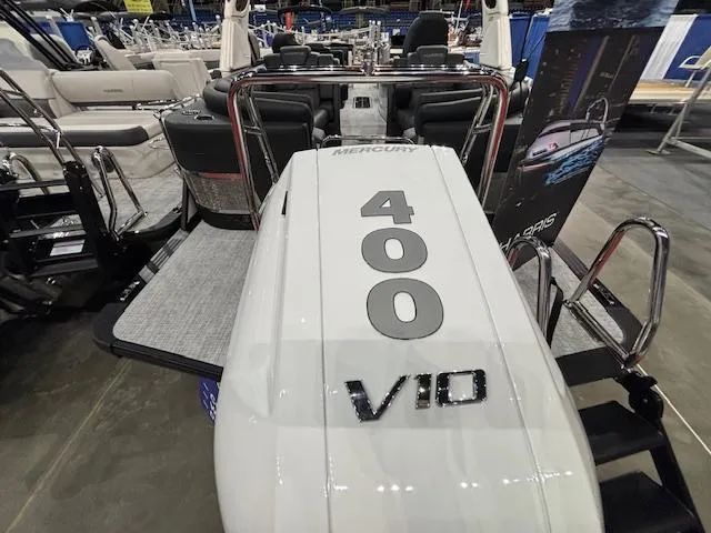 Slide: The Image of 2025 Harris Grand Mariner 250 with Mercury 400 V10 engine at a boat show. - 44