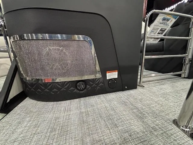 Slide: The Image of 2025 Harris Grand Mariner 250 interior detail with speaker and textured flooring. - 46