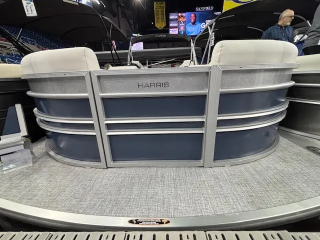 Slide: The Image of 2025 Harris Sunliner 230 CWDH pontoon boat, rear view with seating and branding. - 0