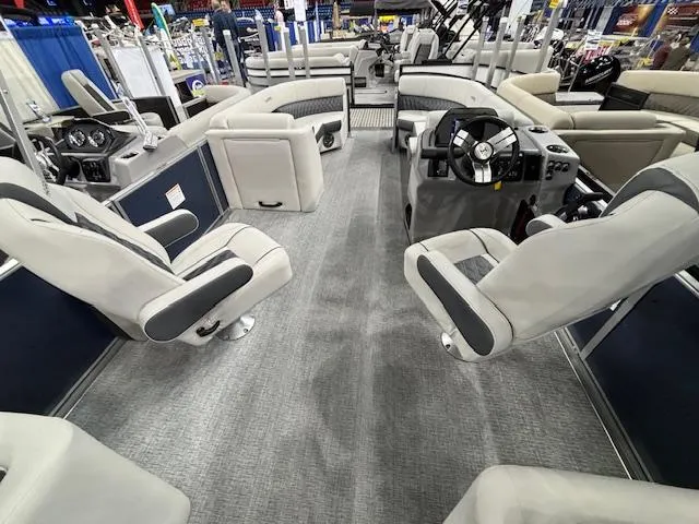 Slide: The Image of 2025 Harris Sunliner 230 CWDH pontoon boat interior with plush seating and modern helm. - 12