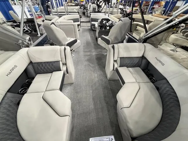 Slide: The Image of 2025 Harris Sunliner 230 CWDH pontoon boat interior with luxurious seating and modern design. - 13