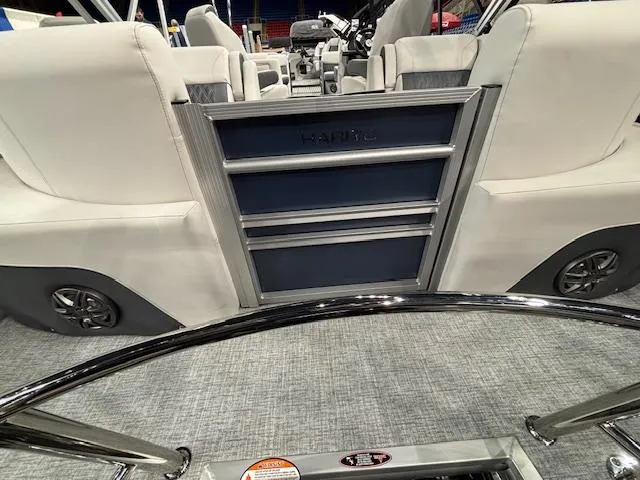 Slide: The Image of 2025 Harris Sunliner 230 CWDH interior with modern seating and sleek design. - 14